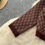 European-style chic and sophisticated two-piece set: round neck long-sleeved knit top with metal buckle and high-waisted wide-leg pants. - Image 9