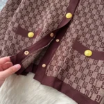 European-style chic and sophisticated two-piece set: round neck long-sleeved knit top with metal buckle and high-waisted wide-leg pants. - Image 3