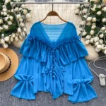 Ruffled trim, bell sleeves, chiffon blouse, loose fit.