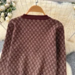 European-style chic and sophisticated two-piece set: round neck long-sleeved knit top with metal buckle and high-waisted wide-leg pants. - Image 7